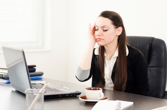 Woman stressed working at the computer